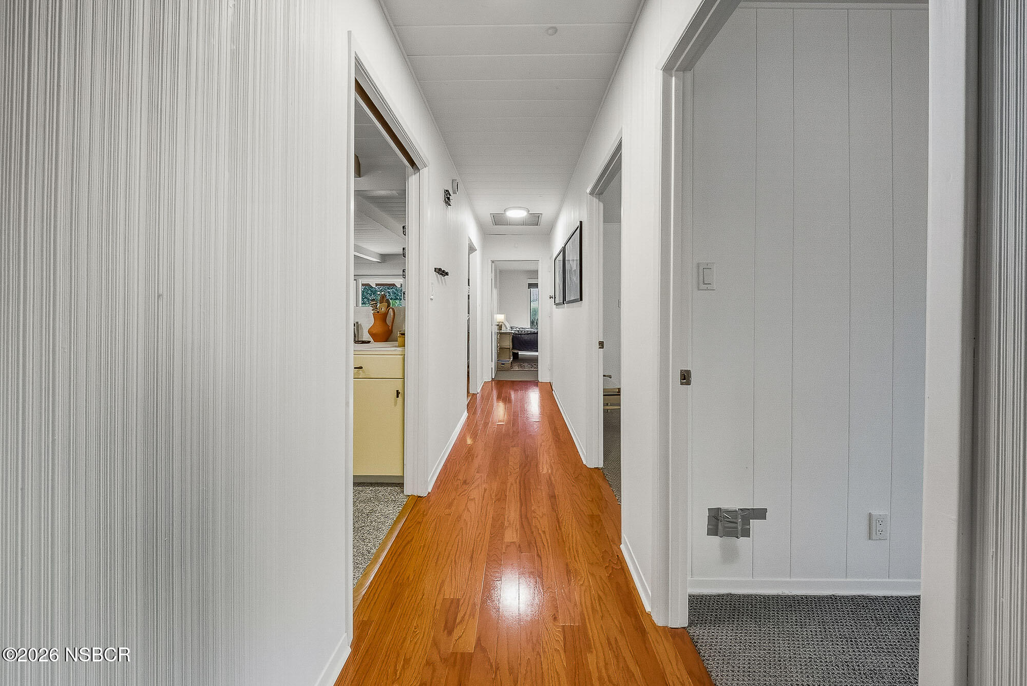 724 North Refugio Road Santa Ynez, CA 93460 - Photo 25 of 47 a view of a hallway with wooden floor and staircase