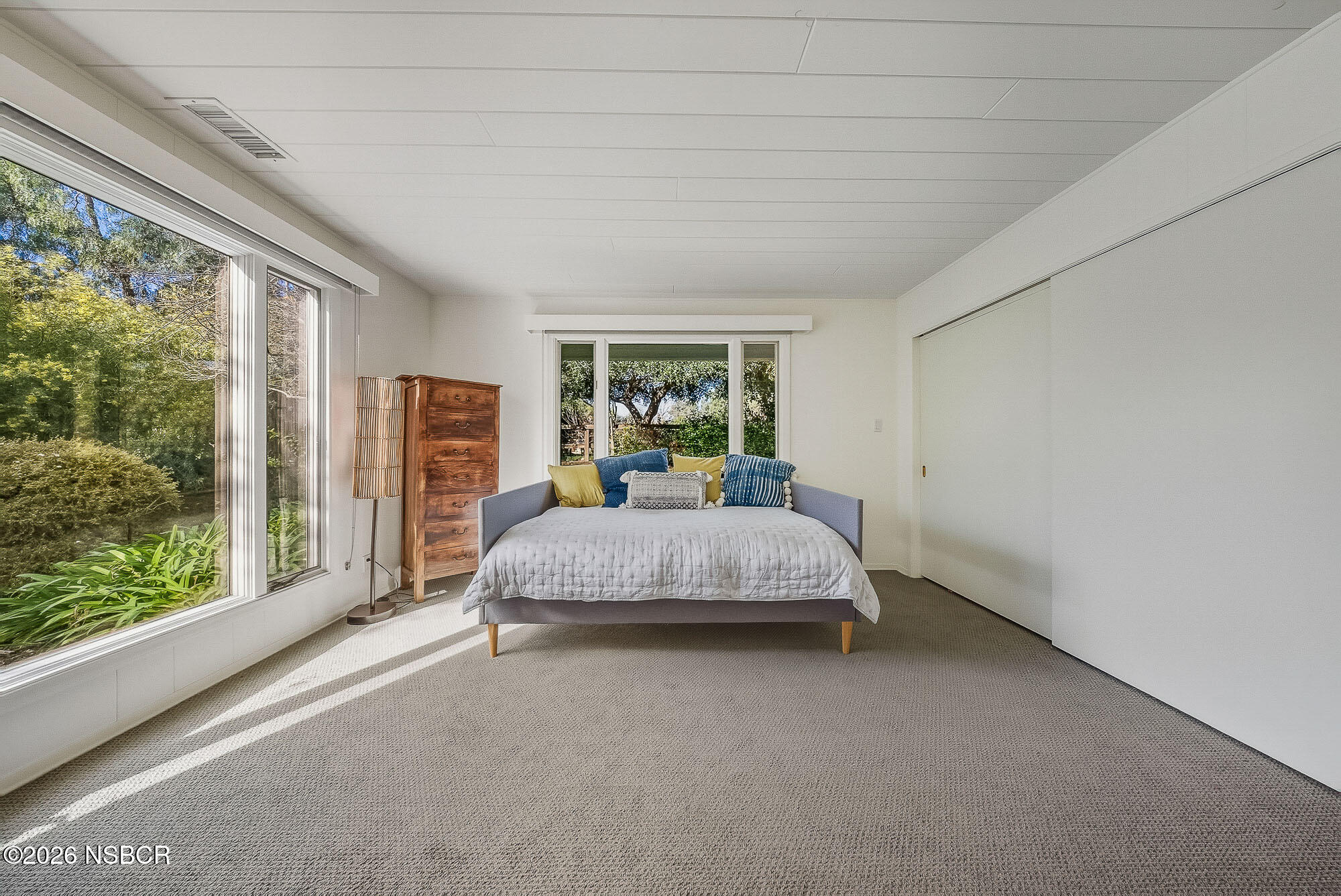 724 North Refugio Road Santa Ynez, CA 93460 - Photo 29 of 47 a spacious bedroom with a large bed and a large window