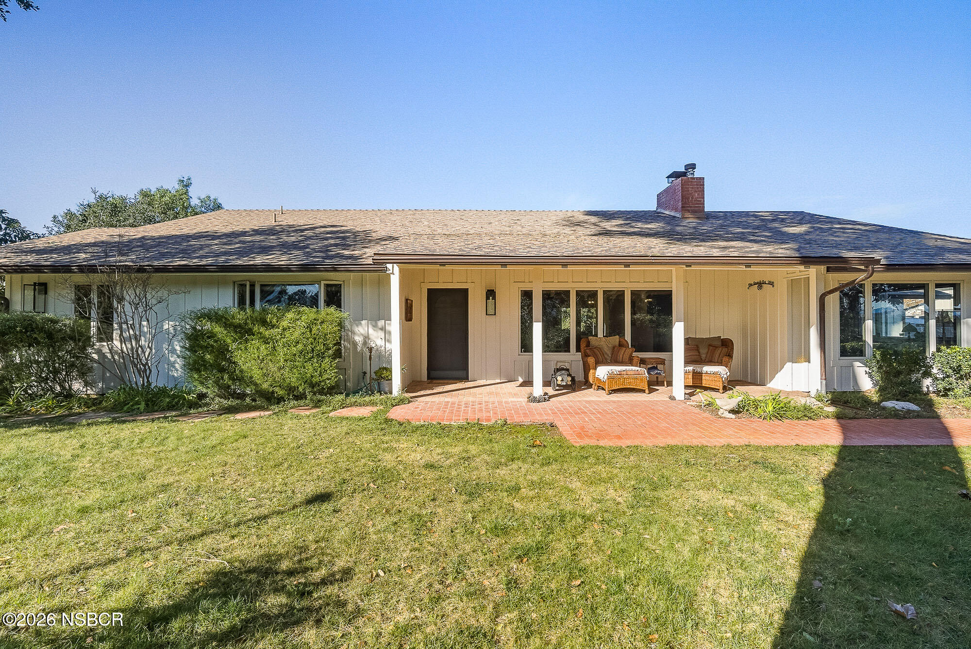 724 North Refugio Road Santa Ynez, CA 93460 - Photo 3 of 47 a front view of house with outdoor seating and yard