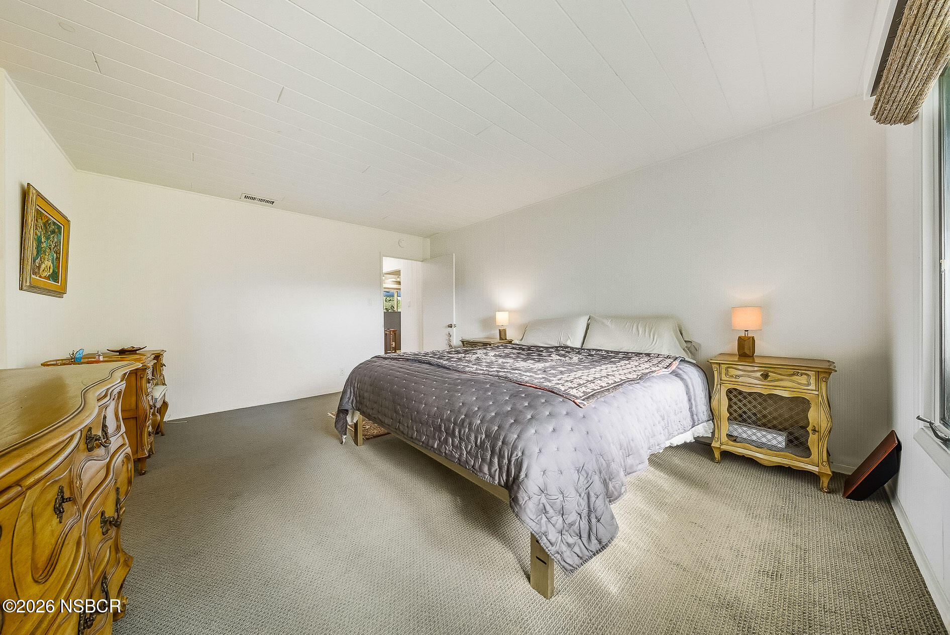 724 North Refugio Road Santa Ynez, CA 93460 - Photo 32 of 47 a bedroom with a bed and a cabinets