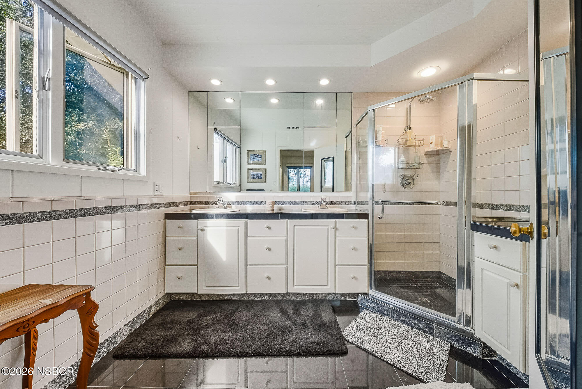 724 North Refugio Road Santa Ynez, CA 93460 - Photo 35 of 47 a bathroom with a granite countertop sink mirror and cabinets