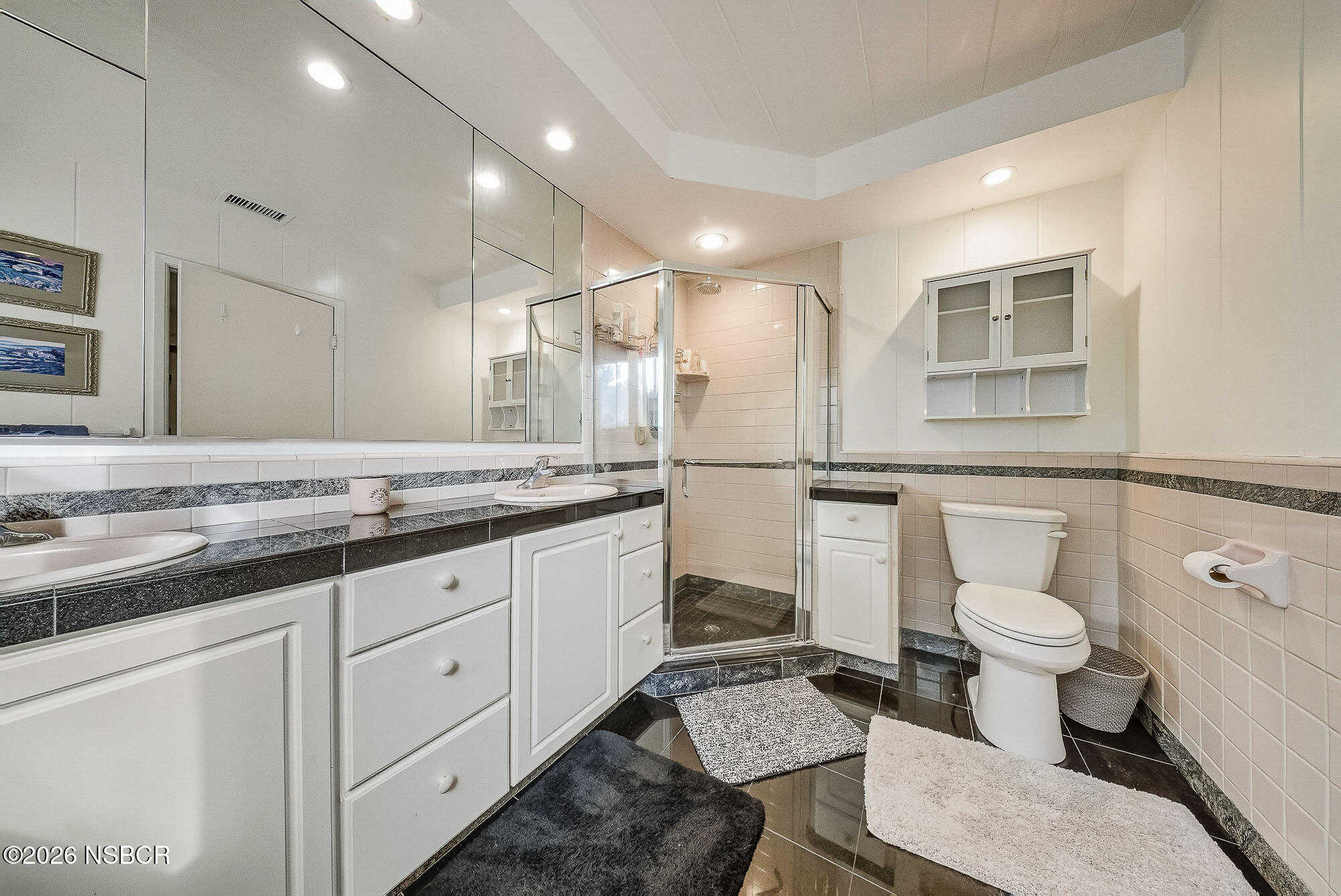 724 North Refugio Road Santa Ynez, CA 93460 - Photo 36 of 47 a bathroom with a granite countertop toilet sink and a mirror