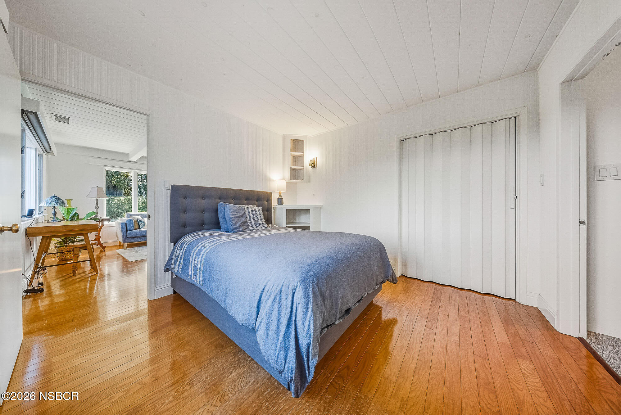 724 North Refugio Road Santa Ynez, CA 93460 - Photo 39 of 47 a bedroom with a bed and wooden floor