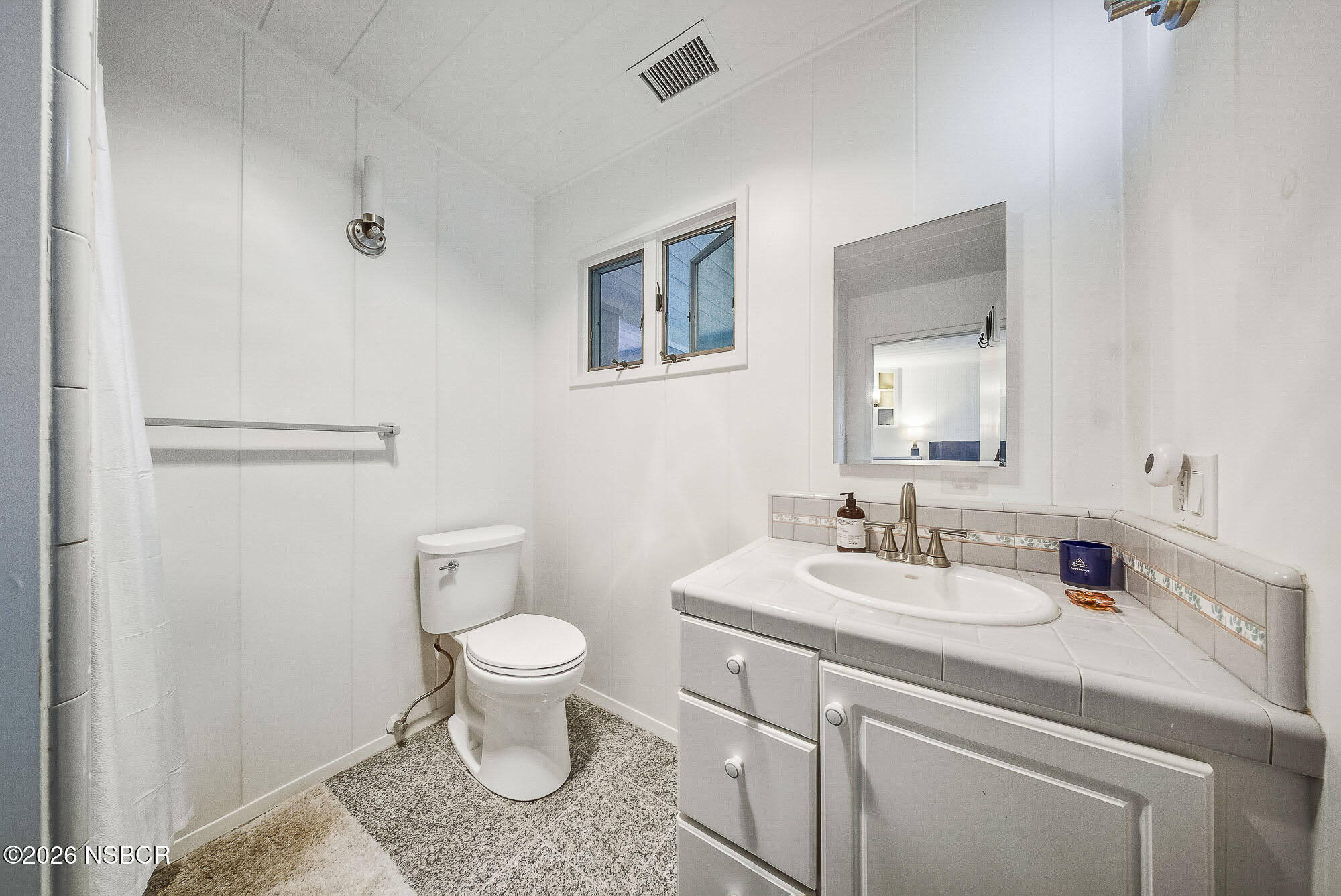 724 North Refugio Road Santa Ynez, CA 93460 - Photo 41 of 47 a bathroom with a sink toilet and a mirror