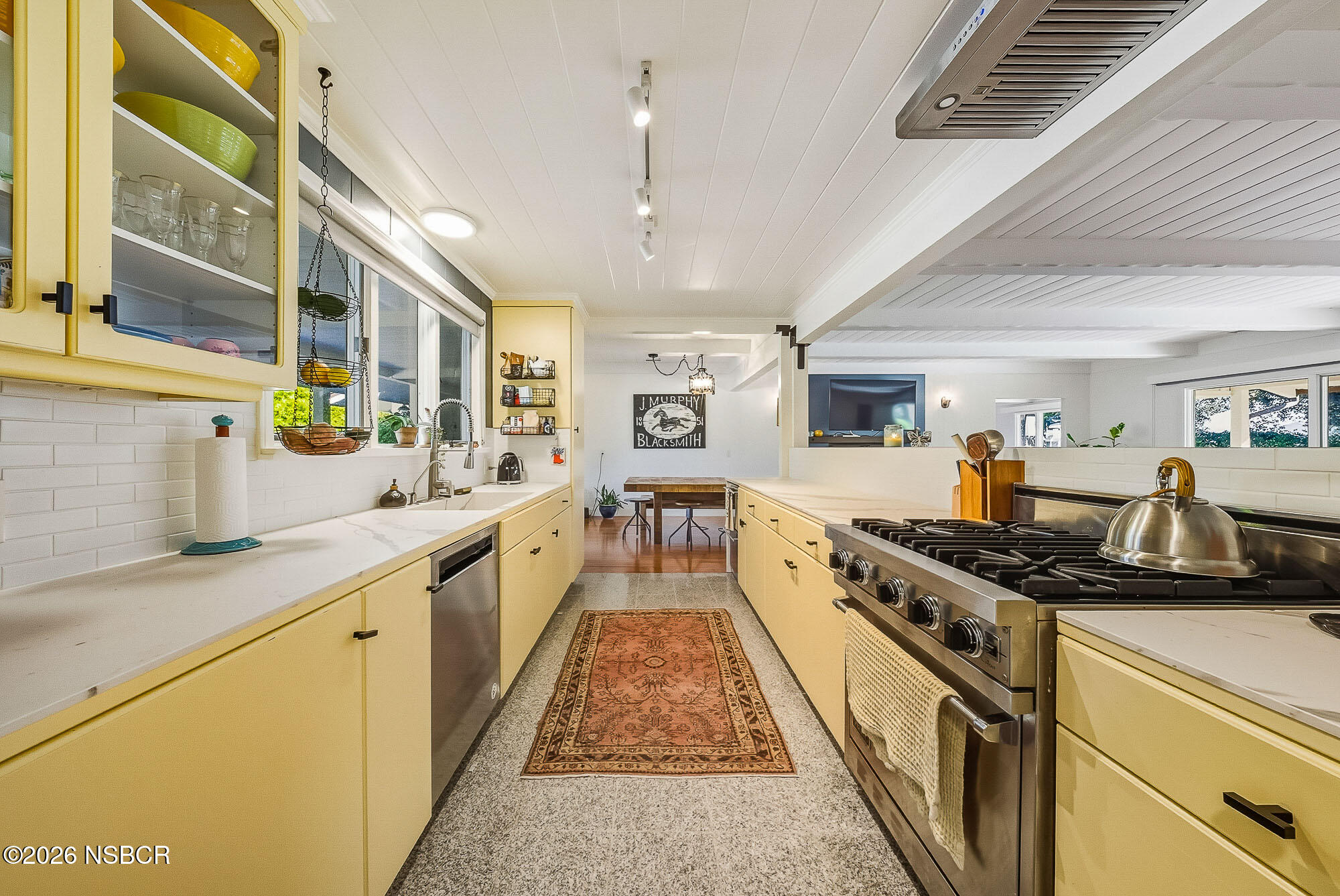 724 North Refugio Road Santa Ynez, CA 93460 - Photo 9 of 47 a large kitchen with stainless steel appliances granite countertop a stove and a sink