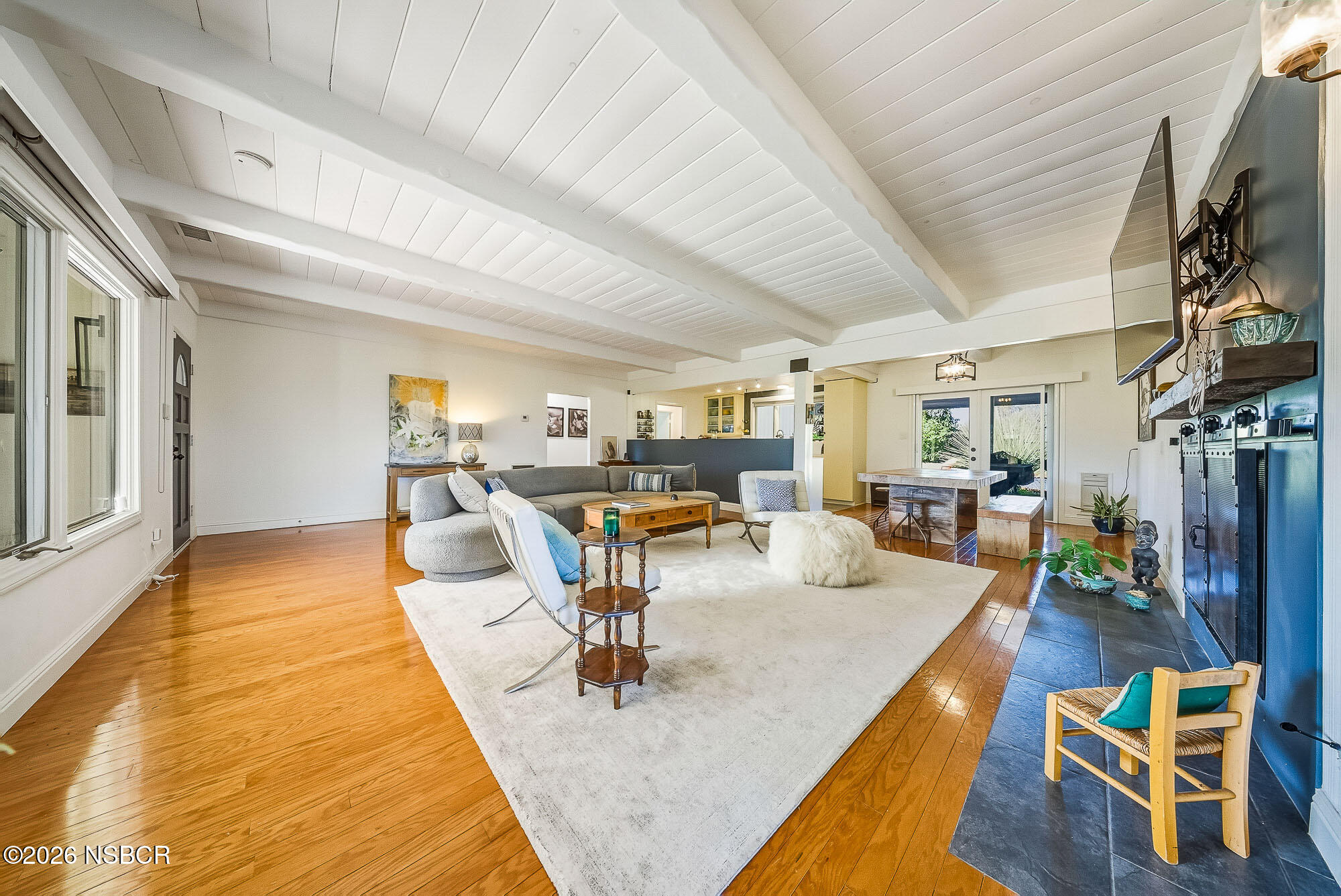 724 North Refugio Road Santa Ynez, CA 93460 - Photo 10 of 47 a living room with furniture a table and kitchen view