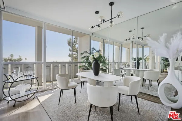 a table and a dining room with furniture window and wooden floor