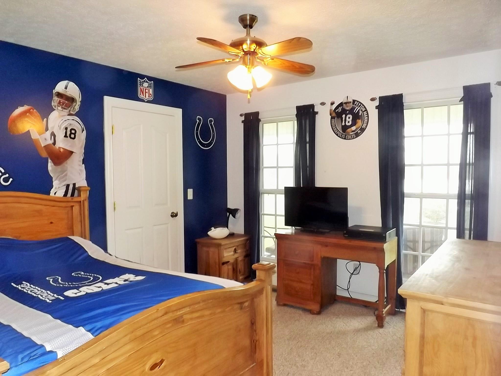 931 Hoodoo Road Beechgrove, TN 37018 - Photo 17 of 28 a bedroom with a bed and a flat screen tv