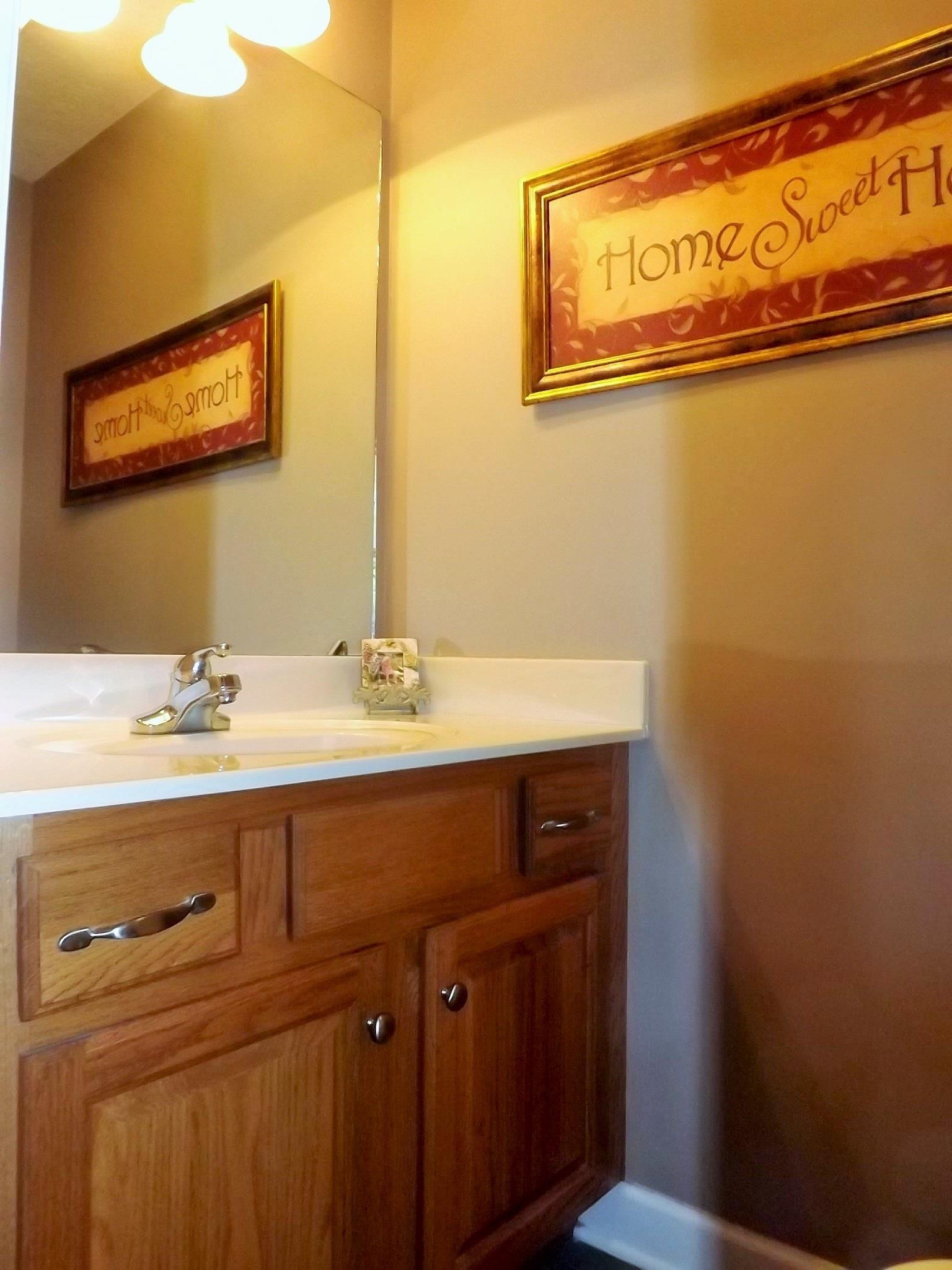 931 Hoodoo Road Beechgrove, TN 37018 - Photo 21 of 28 a bathroom with a sink a mirror and a shower