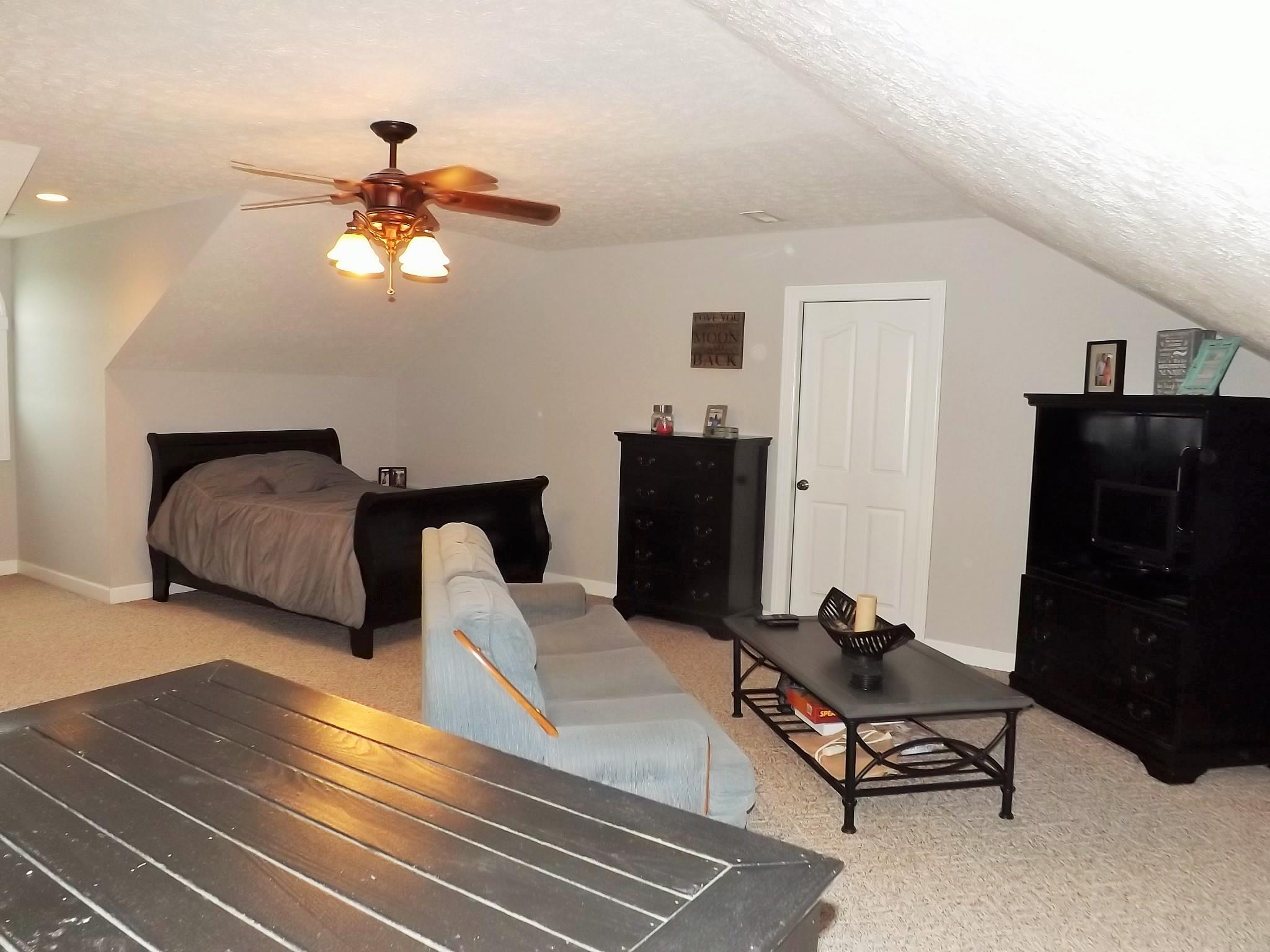 931 Hoodoo Road Beechgrove, TN 37018 - Photo 24 of 28 a living room with furniture and wooden floor