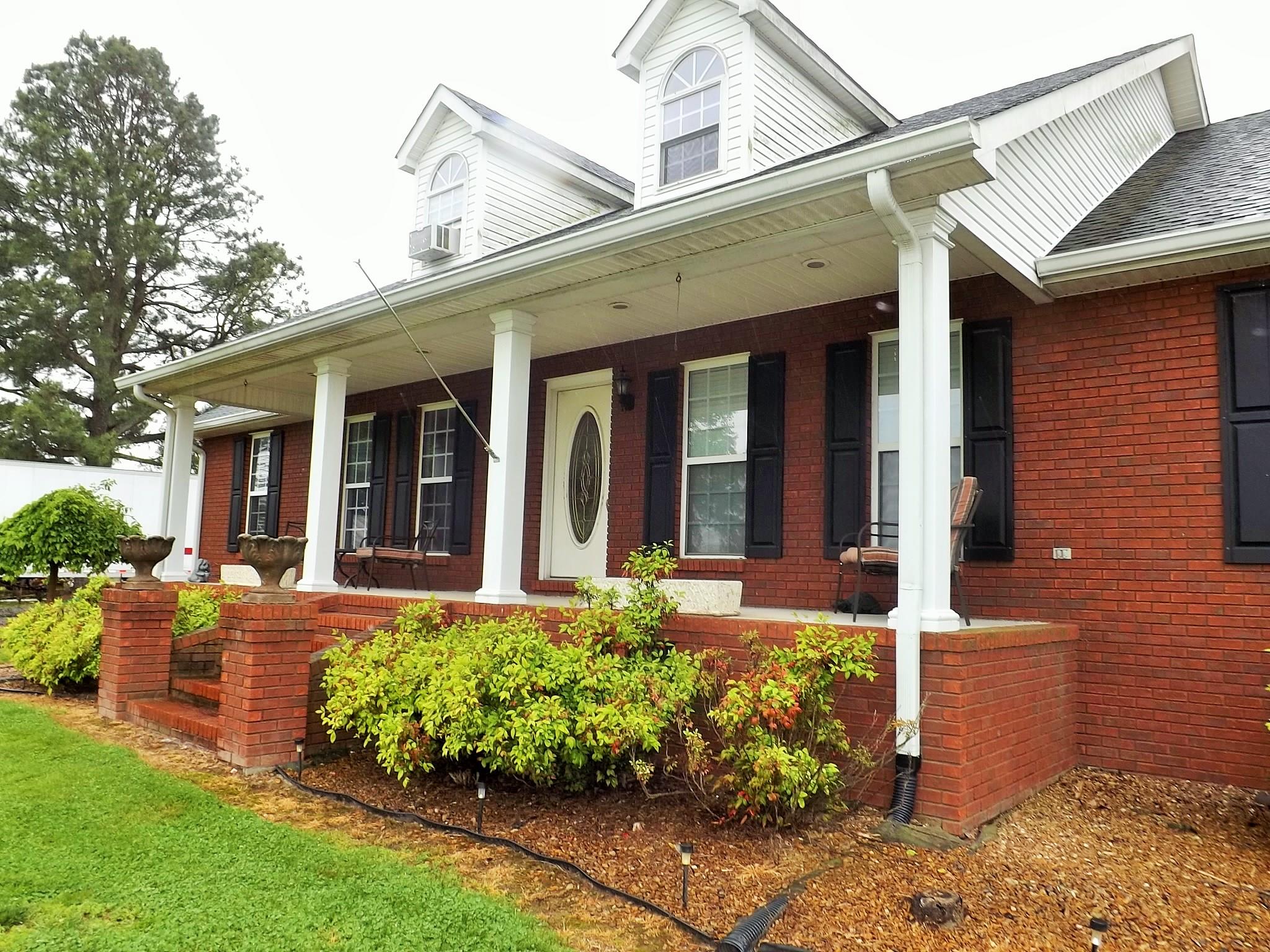 931 Hoodoo Road Beechgrove, TN 37018 - Photo 3 of 28 front view of a brick house with a large window