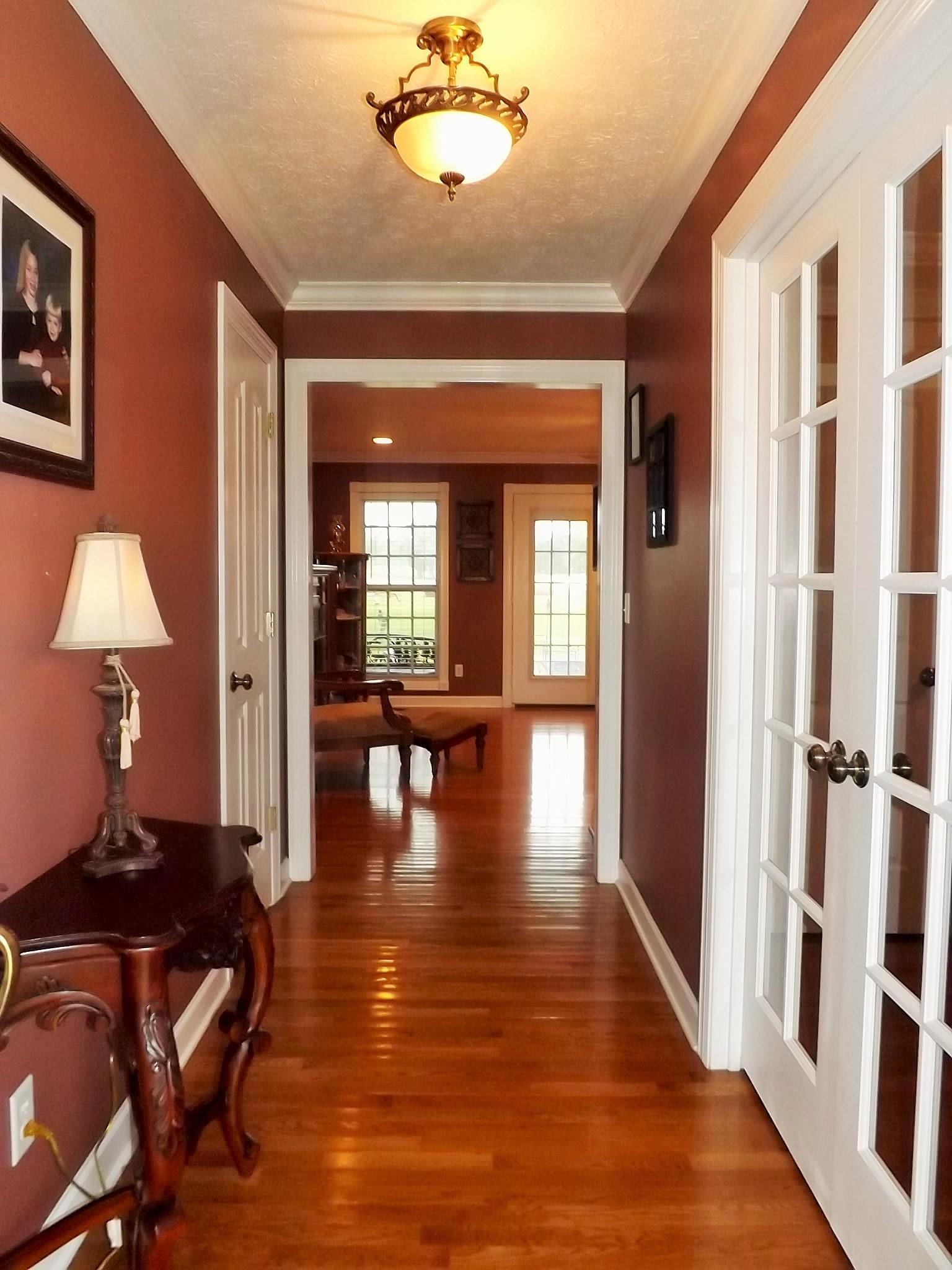 931 Hoodoo Road Beechgrove, TN 37018 - Photo 5 of 28 a view of a livingroom with furniture staircase and a chandelier fan