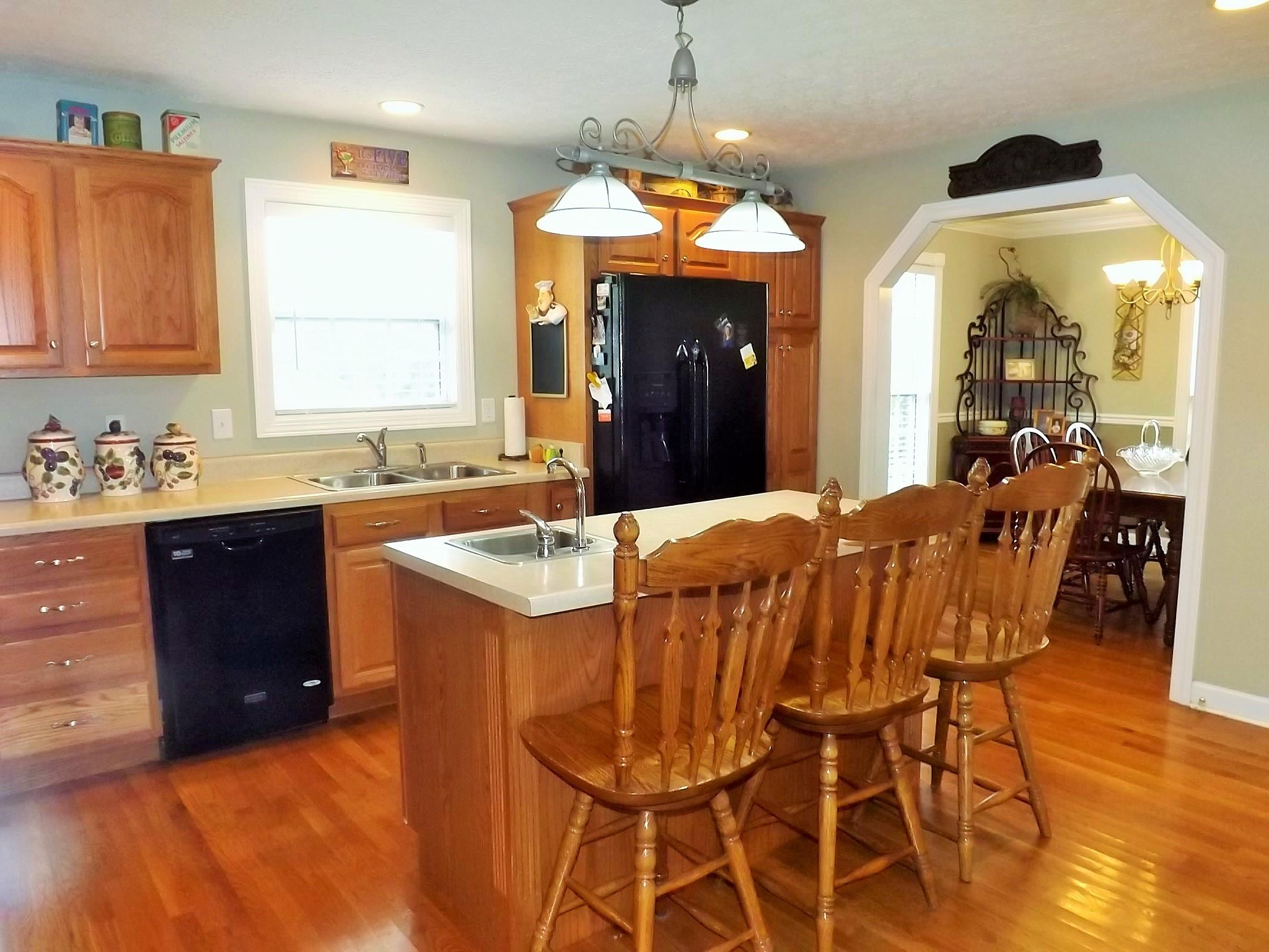931 Hoodoo Road Beechgrove, TN 37018 - Photo 9 of 28 a large kitchen with a table and chairs in it