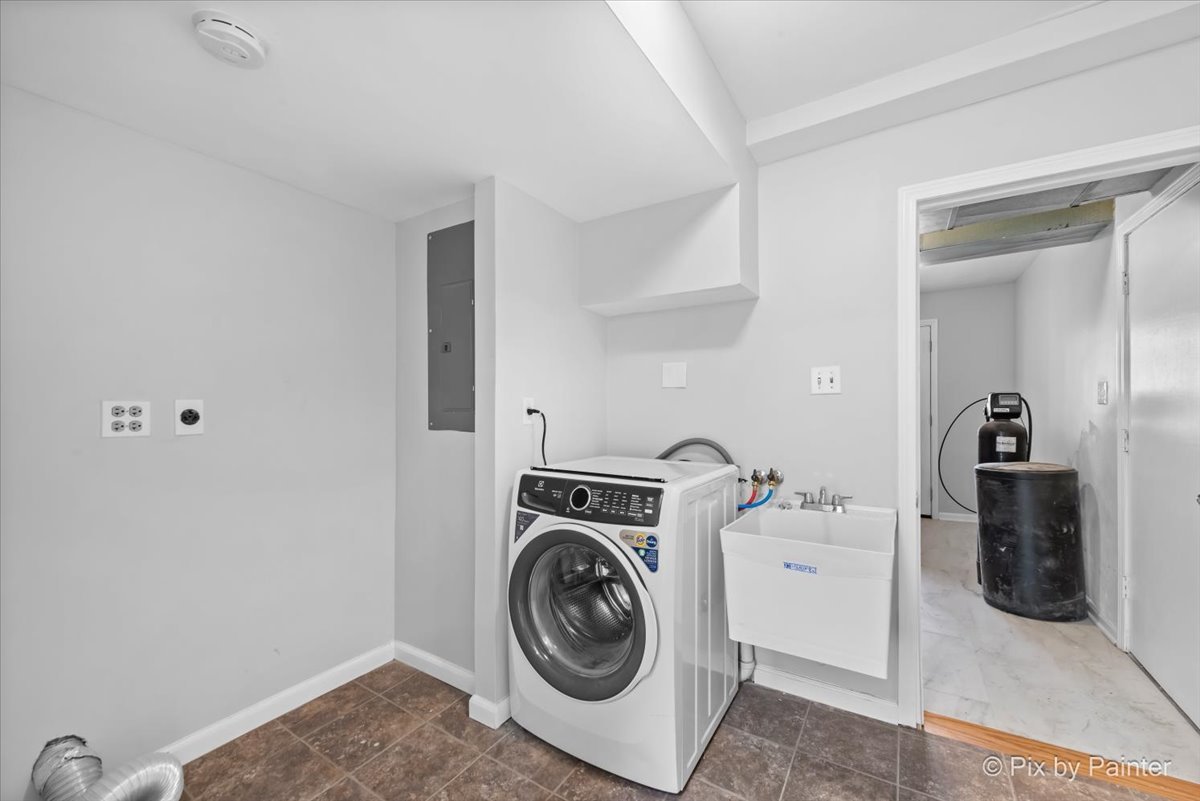 7611 Beverly Way Spring Grove, IL 60081 - Photo 17 of 33 a utility room with sink dryer and washer