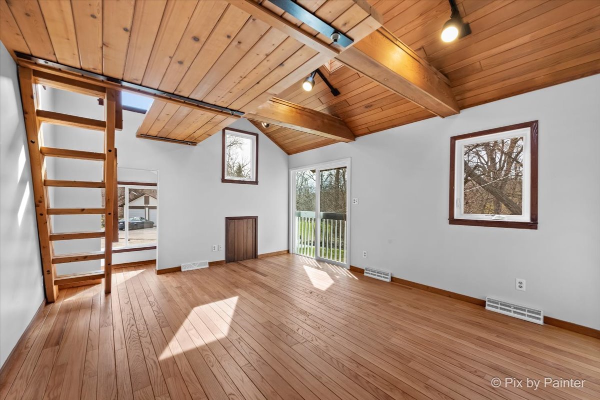 7611 Beverly Way Spring Grove, IL 60081 - Photo 22 of 33 a view of empty room with wooden floor