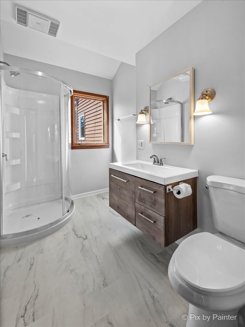 7611 Beverly Way Spring Grove, IL 60081 - Photo 24 of 33 a bathroom with a sink toilet and shower