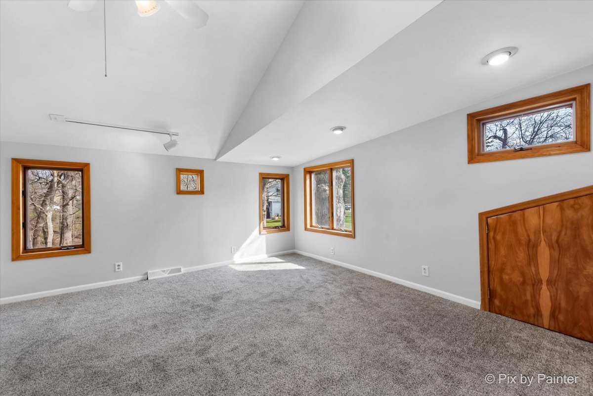 7611 Beverly Way Spring Grove, IL 60081 - Photo 25 of 33 a view of an empty room with a window