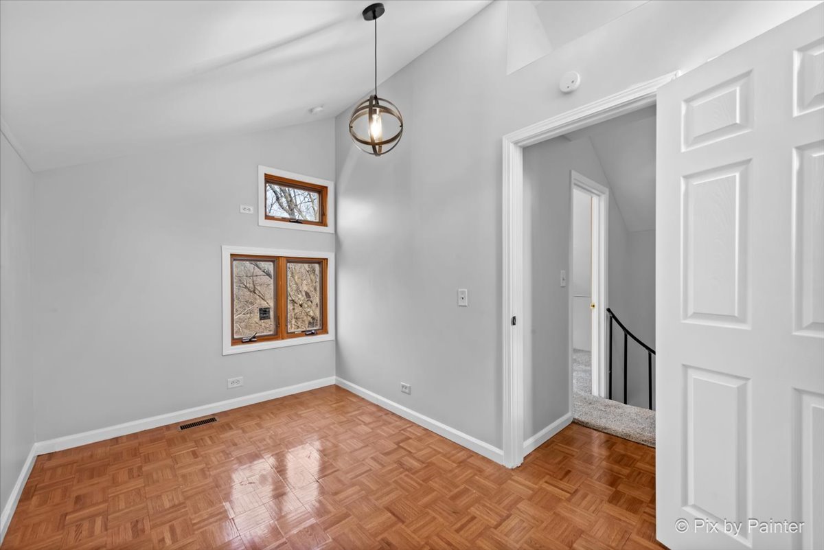 7611 Beverly Way Spring Grove, IL 60081 - Photo 27 of 33 a view of an empty room with a window