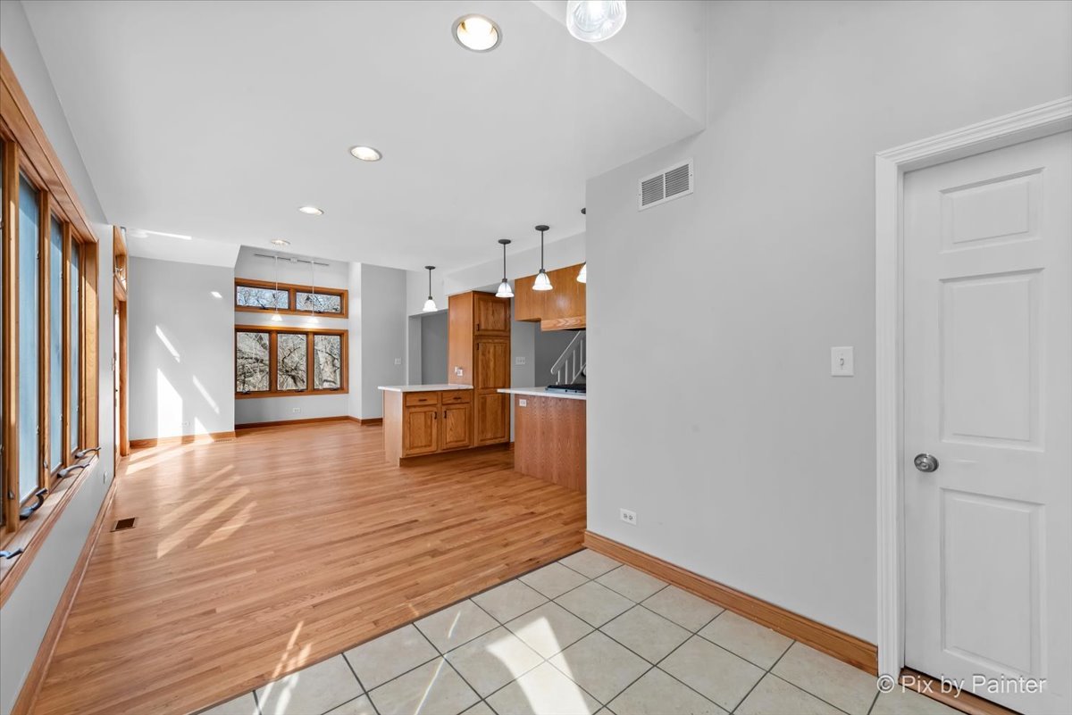 7611 Beverly Way Spring Grove, IL 60081 - Photo 3 of 33 a view of a kitchen with wooden floor