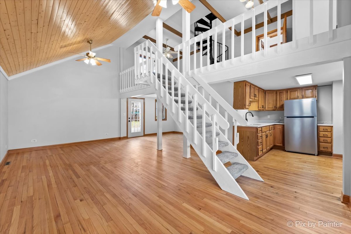 7611 Beverly Way Spring Grove, IL 60081 - Photo 10 of 33 a view of entryway and hall with wooden floor