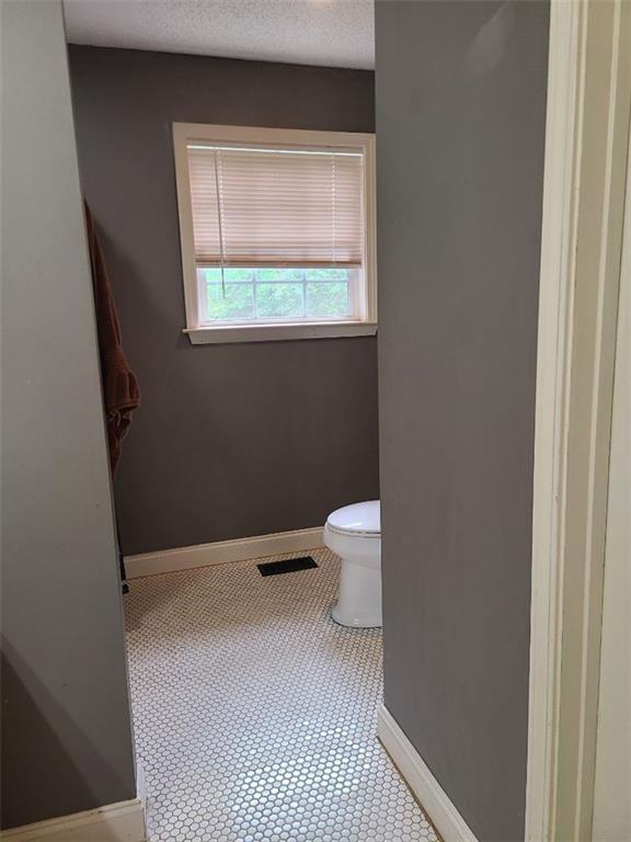 805 Gose Road Forsyth, GA 31029 - Photo 15 of 29 a bathroom with a toilet