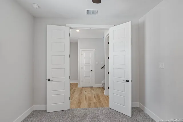 a view of a bathroom with wooden floor