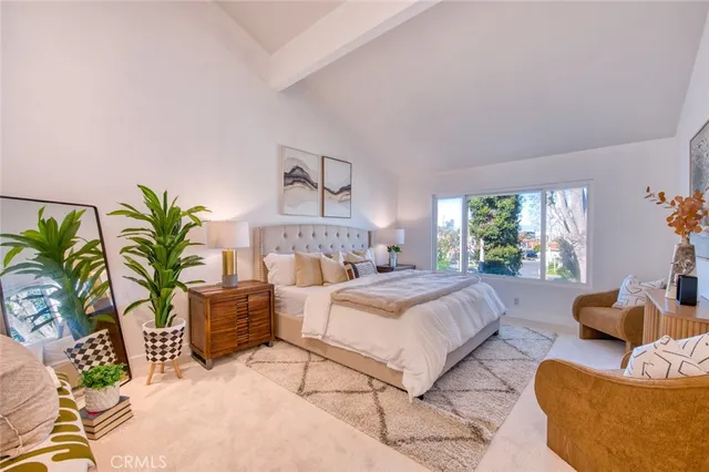 a bedroom with a bed and a couch