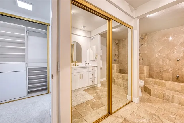 a bathroom with a shower and a sink