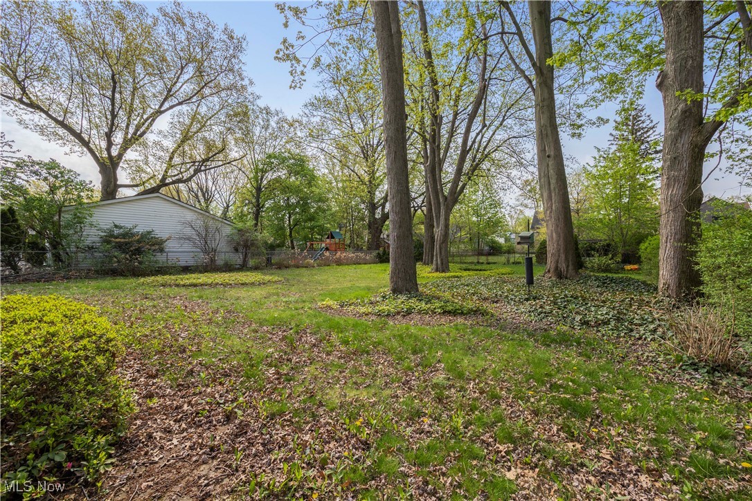 26907 Lake Road Bay Village, OH 44140 - Photo 21 of 33 The backyard is private and features mature trees.