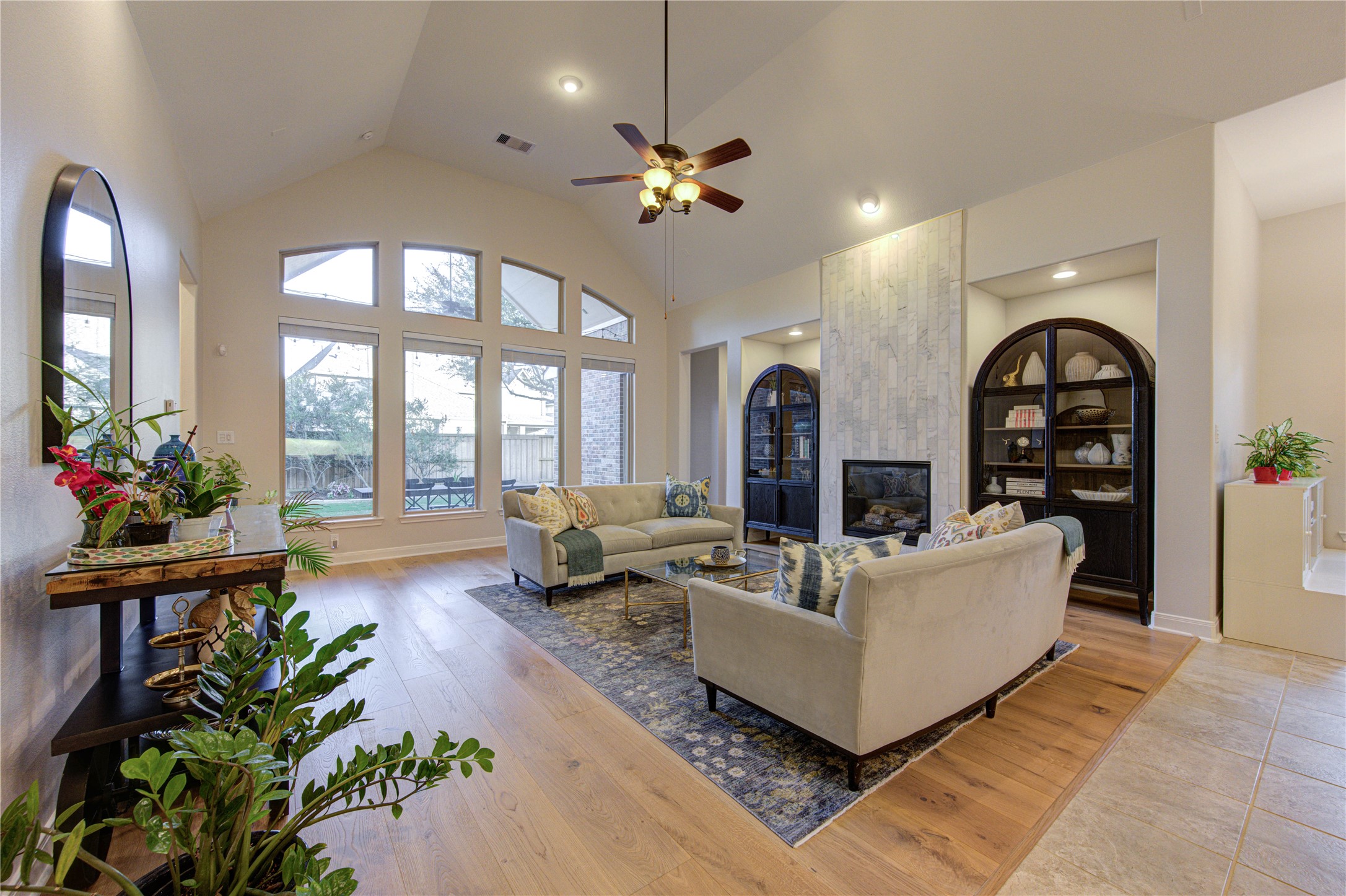 17431 Endel Way Richmond, TX 77407 - Photo 11 of 49 Family room with high ceilings and modern fireplace