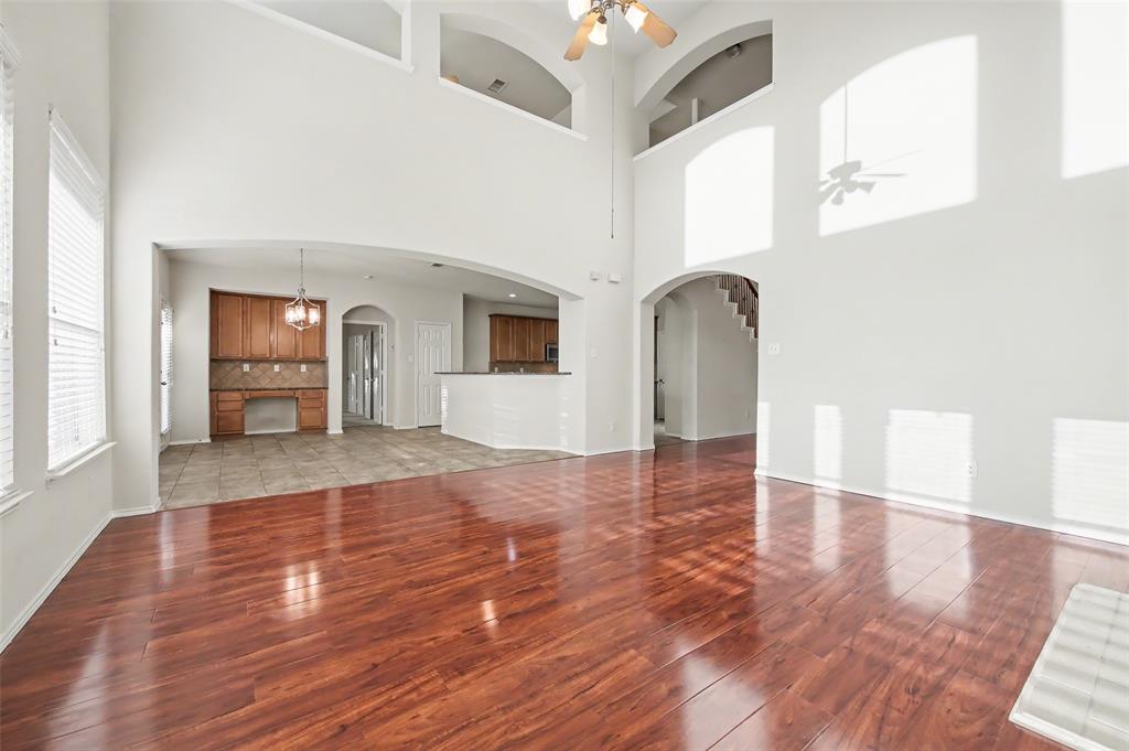 4902 Spring Lake Parkway Mansfield, TX 76063 - Photo 14 of 38 a view of a living room with kitchen and furniture