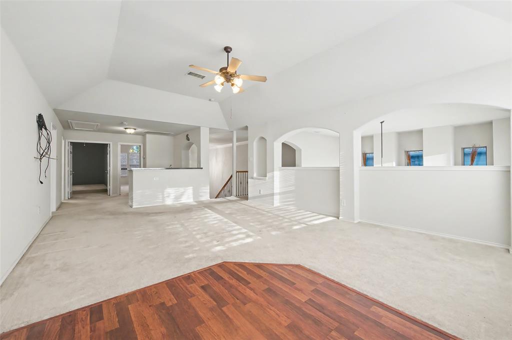 4902 Spring Lake Parkway Mansfield, TX 76063 - Photo 22 of 38 a view of a kitchen with a sink and a chandelier