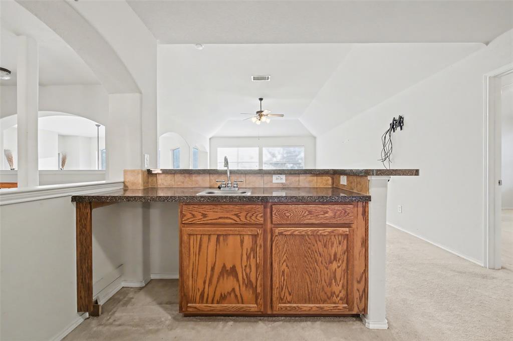 4902 Spring Lake Parkway Mansfield, TX 76063 - Photo 25 of 38 a bathroom with a sink and a mirror