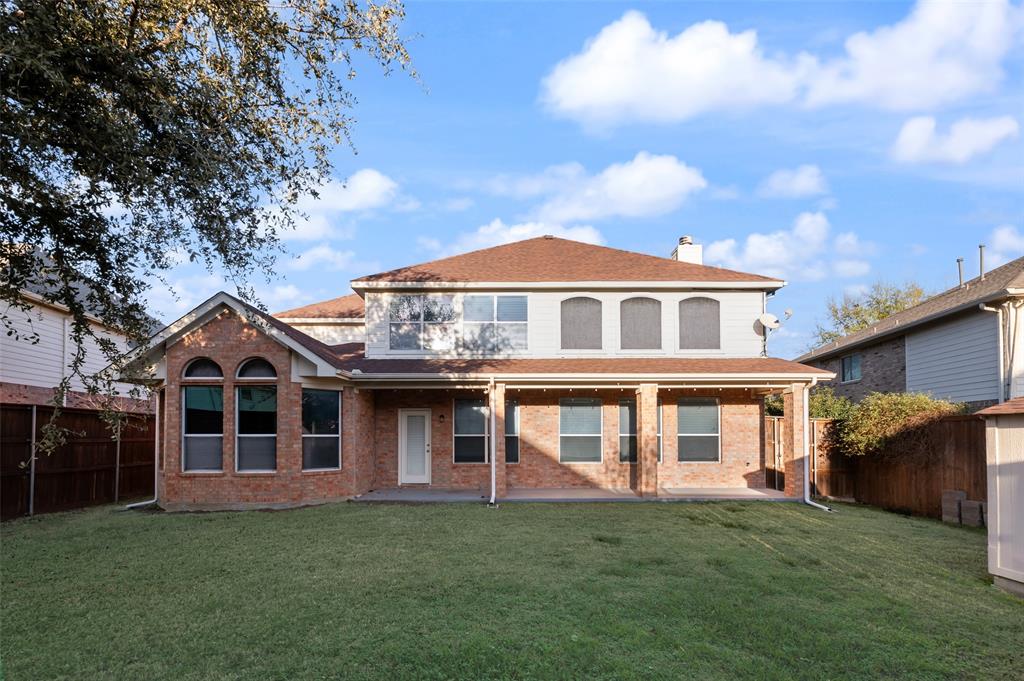 4902 Spring Lake Parkway Mansfield, TX 76063 - Photo 34 of 38 a front view of a house with a garden