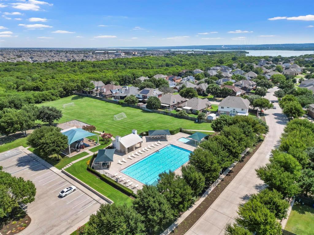 4902 Spring Lake Parkway Mansfield, TX 76063 - Photo 37 of 38 an aerial view of residential houses with outdoor space and trees