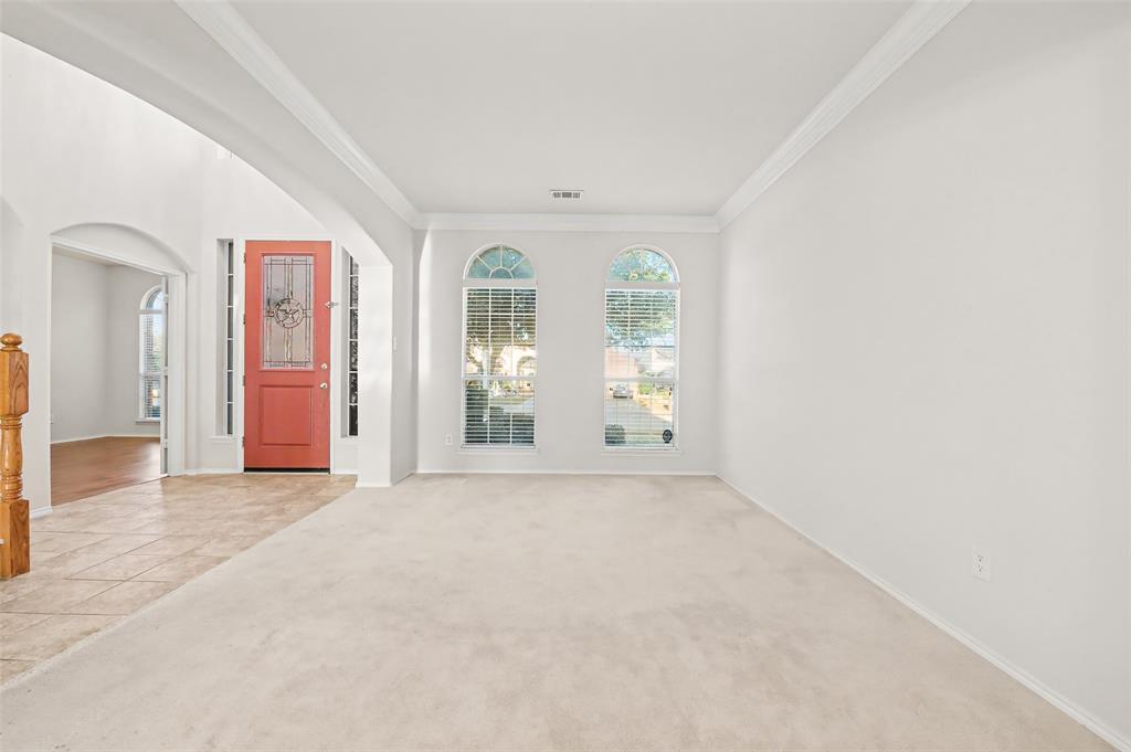 4902 Spring Lake Parkway Mansfield, TX 76063 - Photo 7 of 38 an empty room with windows and closet