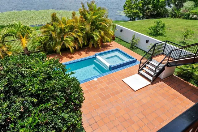 a kitchen with a sink a counter top space cabinets and stainless steel appliances
