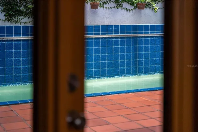 a view of a chair and table in the balcony