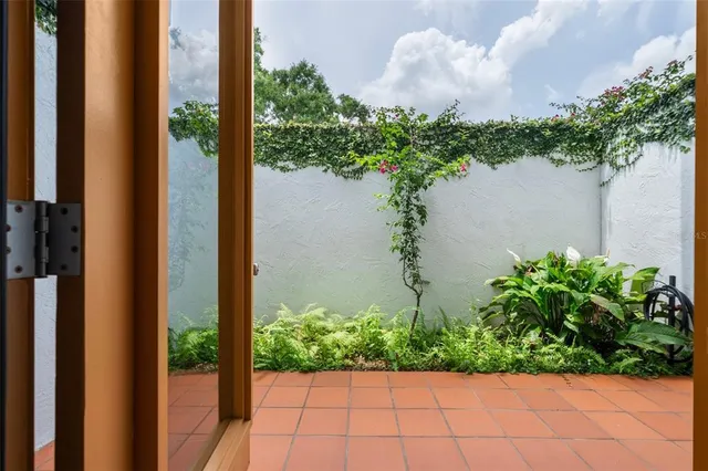 a spacious bedroom with a bed and a shower