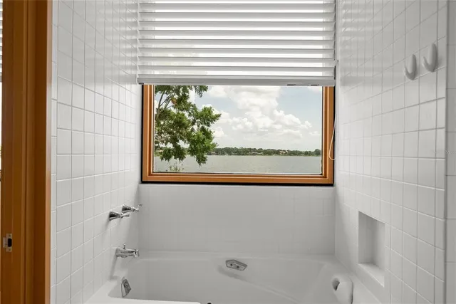 a view of a white building with many windows