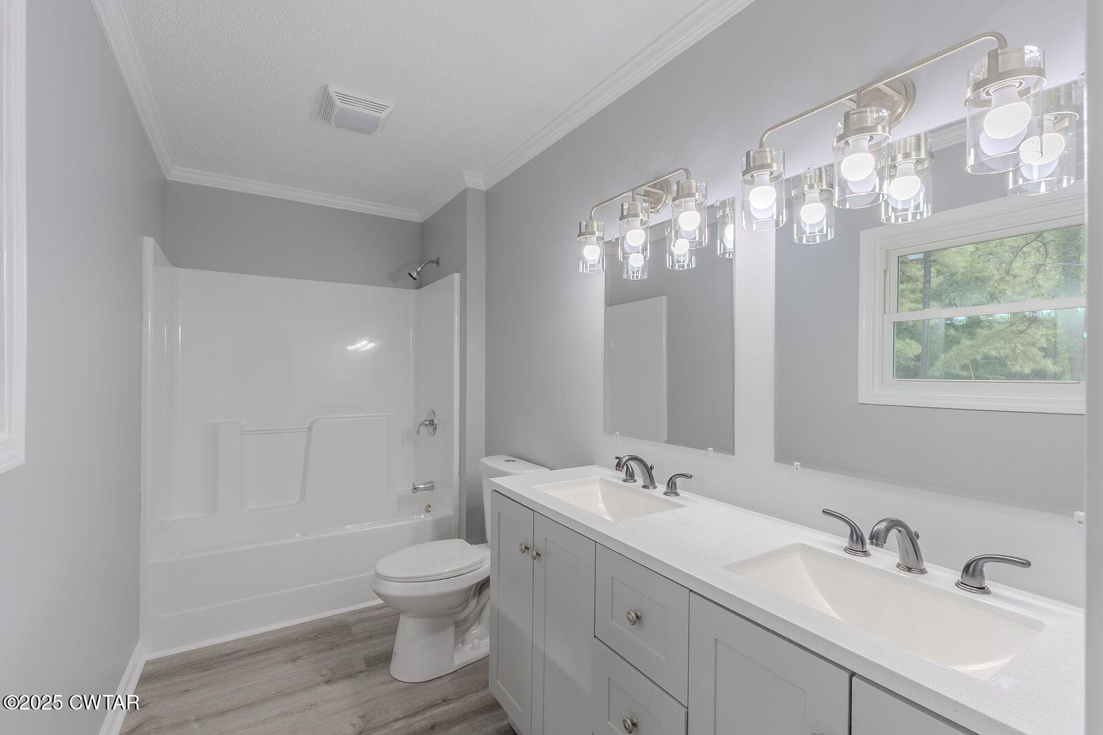 77 Upper Zion Road Brownsville, TN 38012 - Photo 13 of 27 a bathroom with a double vanity sink mirror and toilet