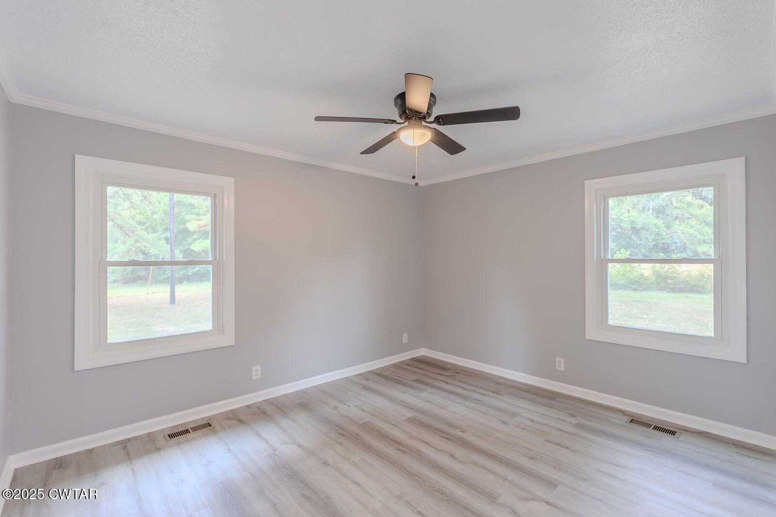 77 Upper Zion Road Brownsville, TN 38012 - Photo 14 of 27 a view of a room with wooden floor and windows