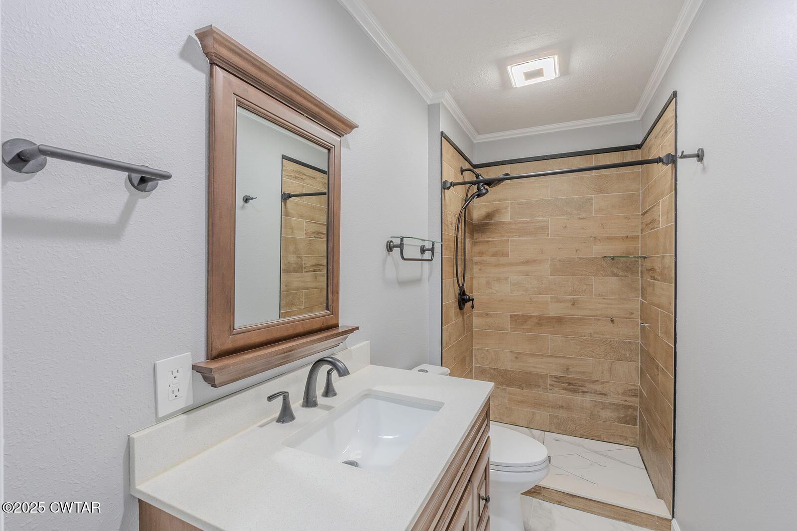77 Upper Zion Road Brownsville, TN 38012 - Photo 17 of 27 a bathroom with a sink and a mirror