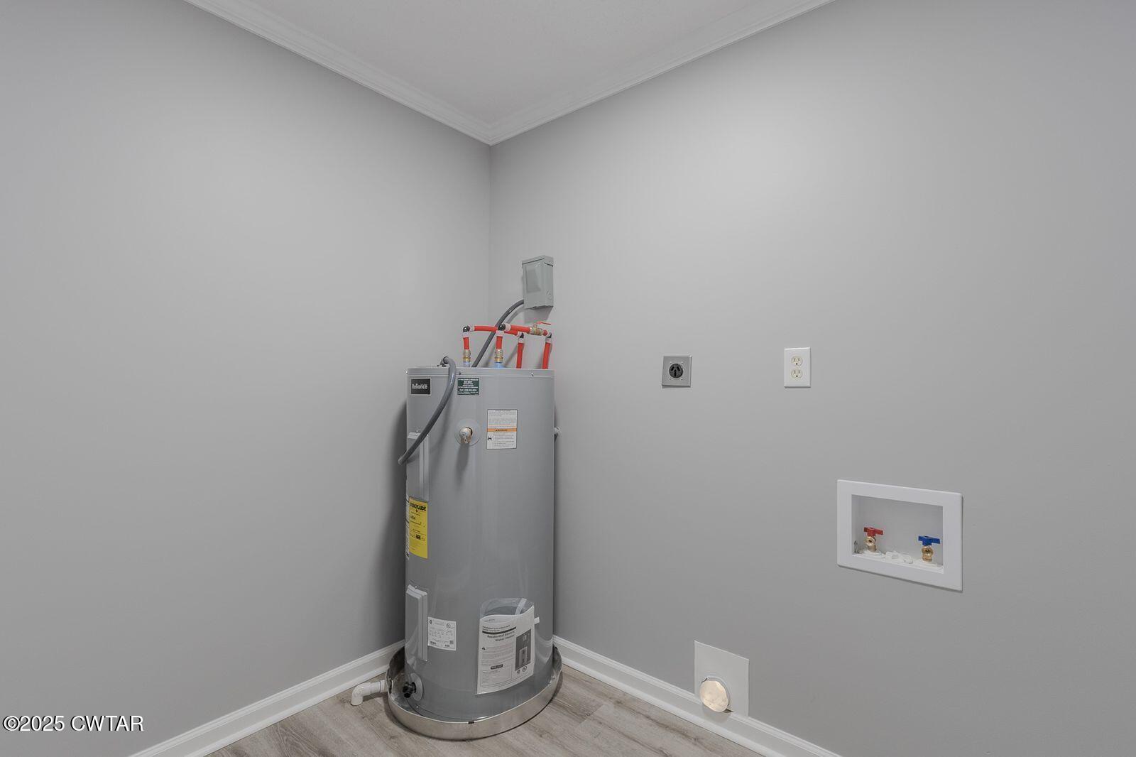 77 Upper Zion Road Brownsville, TN 38012 - Photo 18 of 27 a view of storage and utility room with racks on the wall