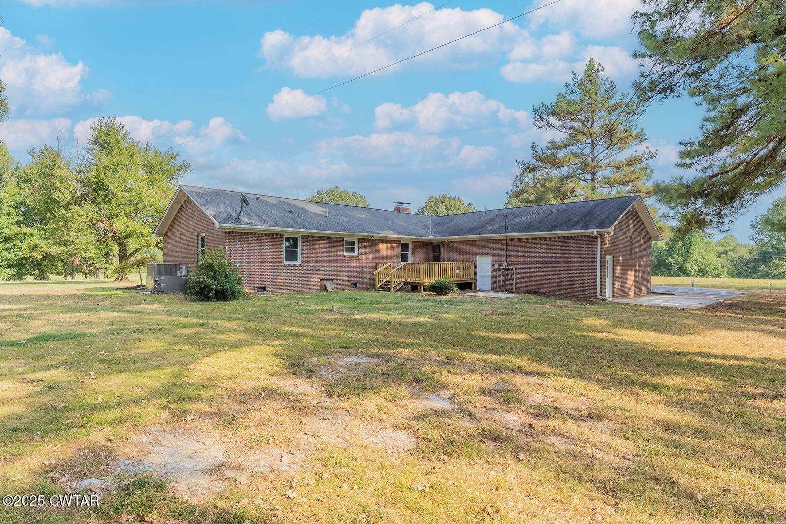 77 Upper Zion Road Brownsville, TN 38012 - Photo 22 of 27 a view of a house with a yard