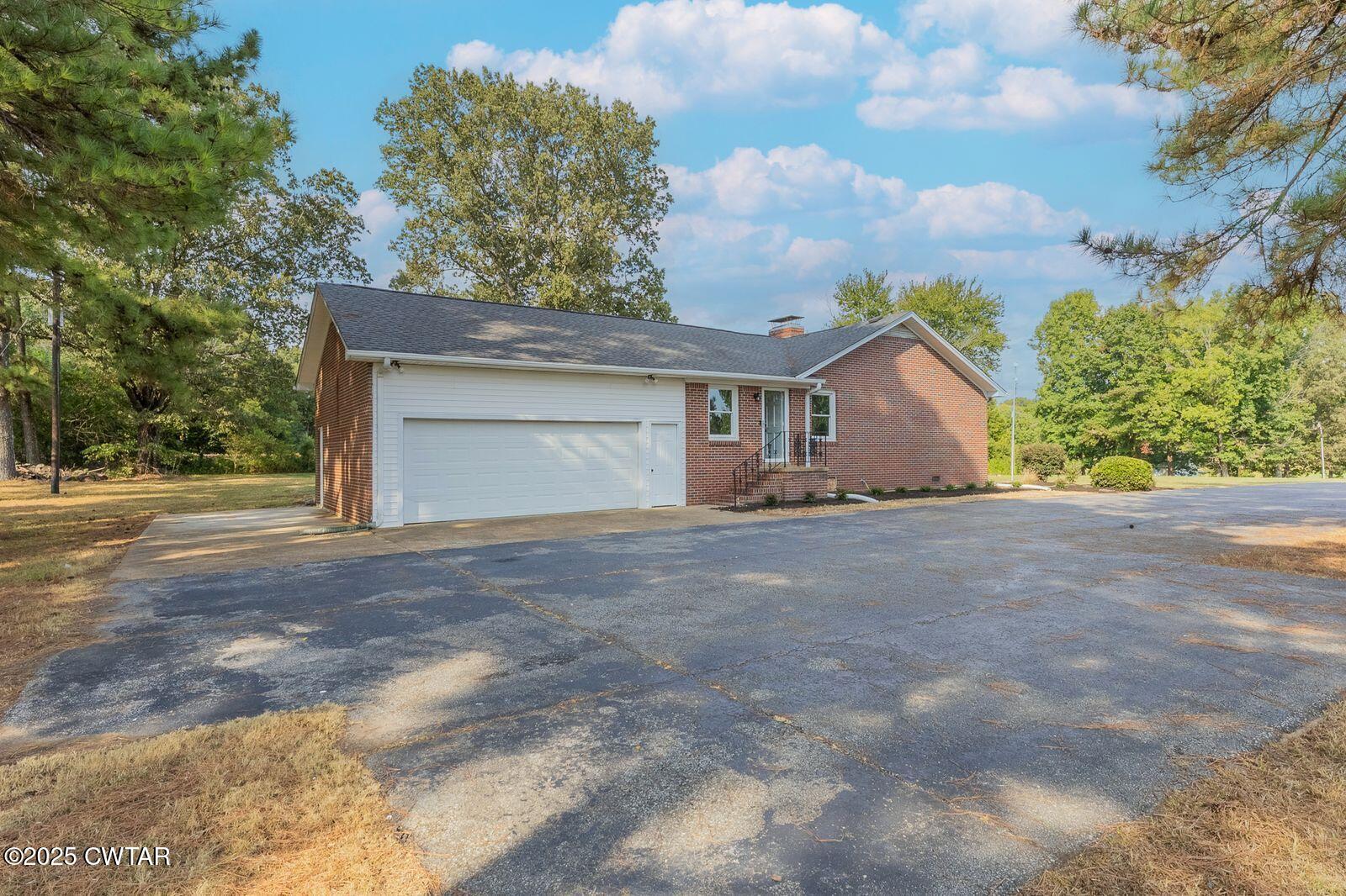 77 Upper Zion Road Brownsville, TN 38012 - Photo 23 of 27 a view of house with yard and entertaining space
