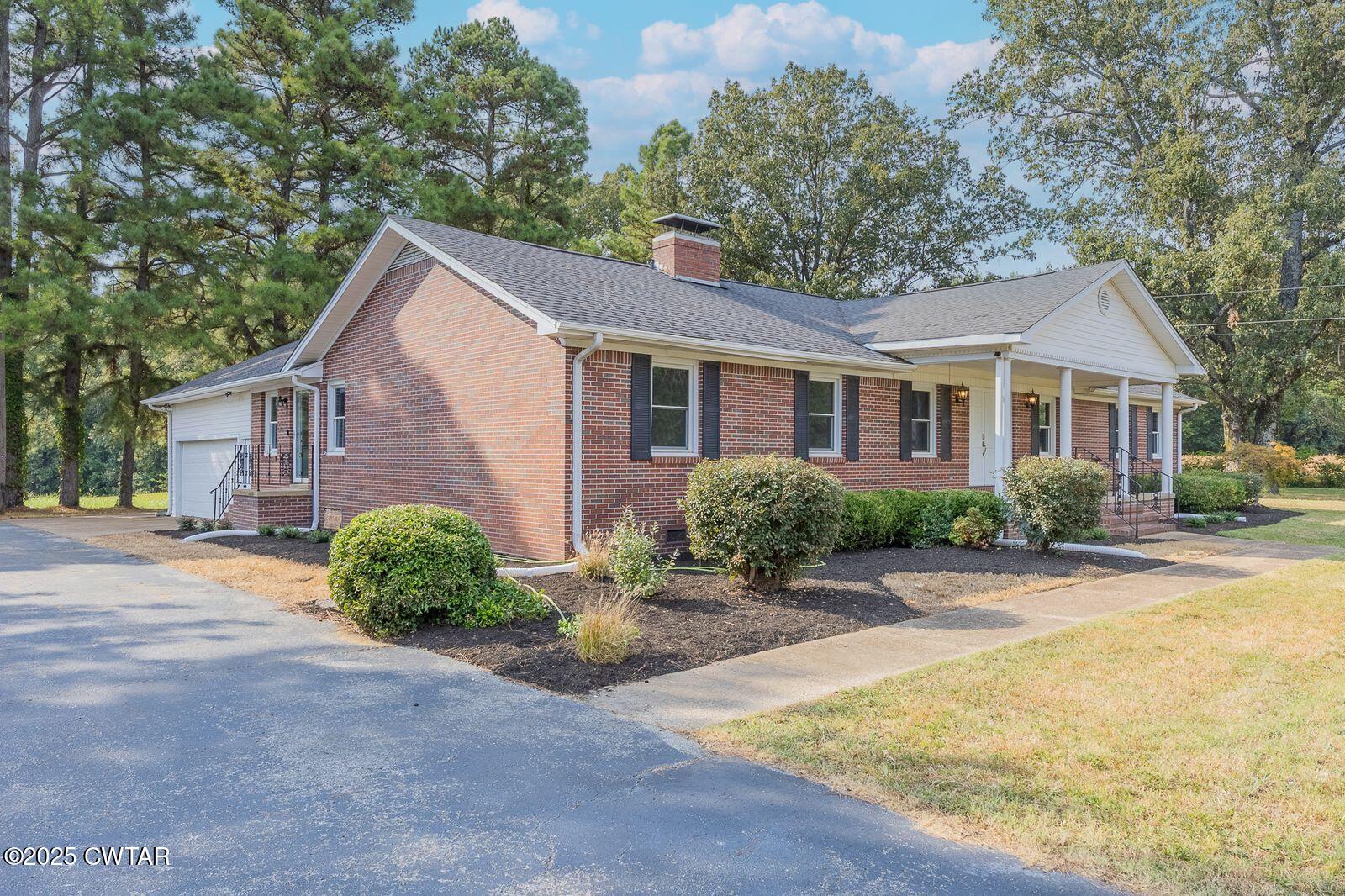 77 Upper Zion Road Brownsville, TN 38012 - Photo 25 of 27 a view of a house with roof and a tree