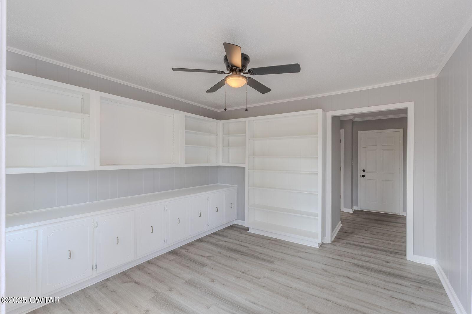 77 Upper Zion Road Brownsville, TN 38012 - Photo 9 of 27 a view of empty room with wooden floor and ceiling fan