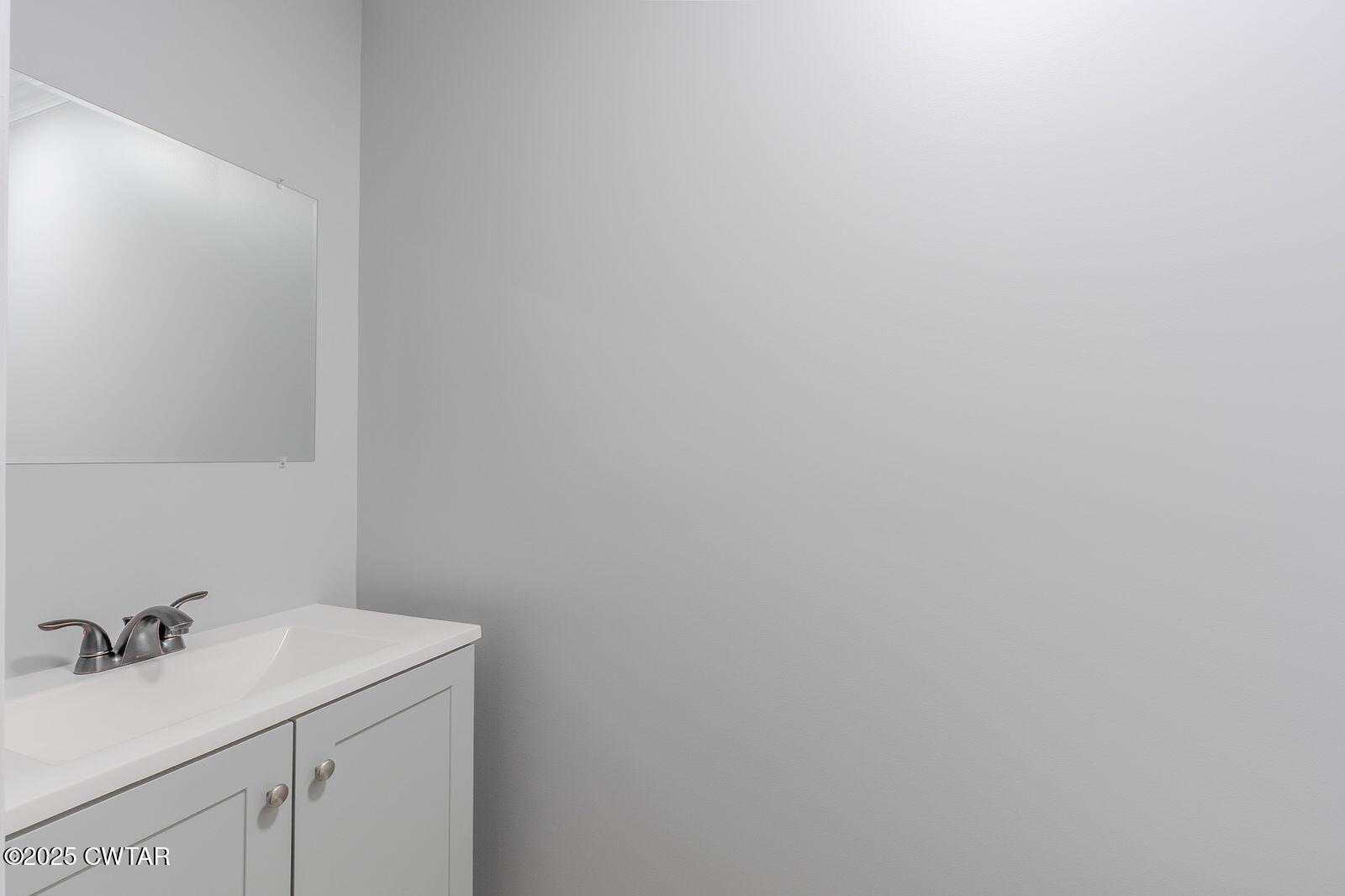 77 Upper Zion Road Brownsville, TN 38012 - Photo 10 of 27 a bathroom with a sink and cabinets