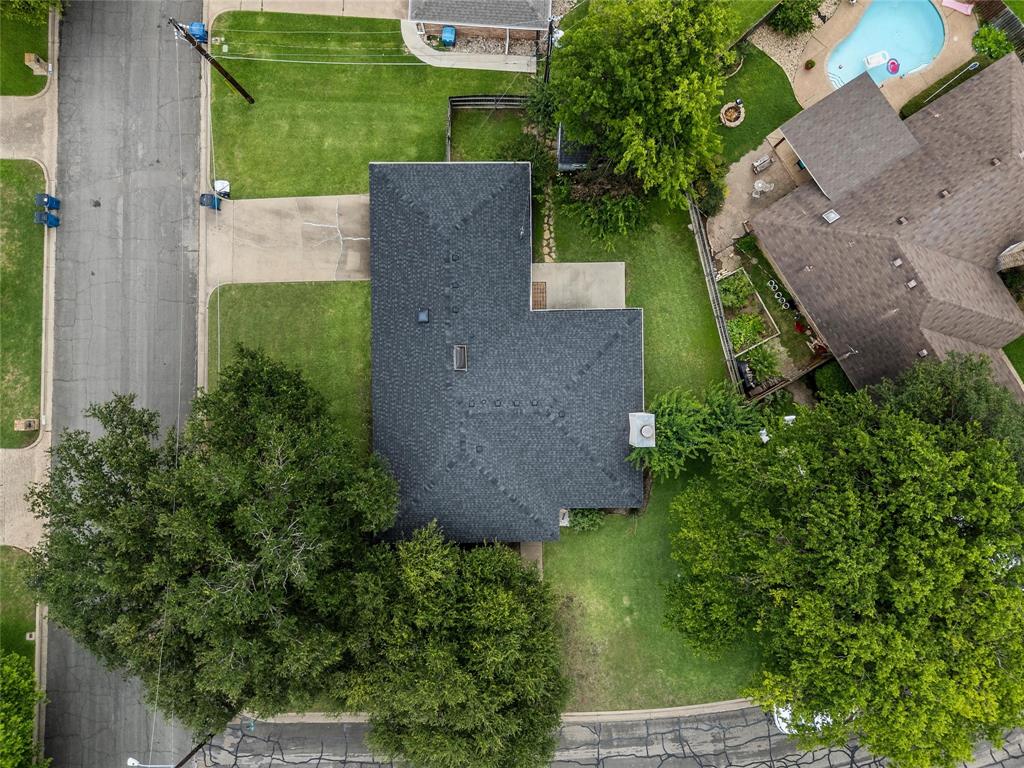 310 Ruth Drive Hewitt, TX 76643 - Photo 22 of 25 Aerial perspective showcasing a property with a dark shingle roof and surrounding green lawns